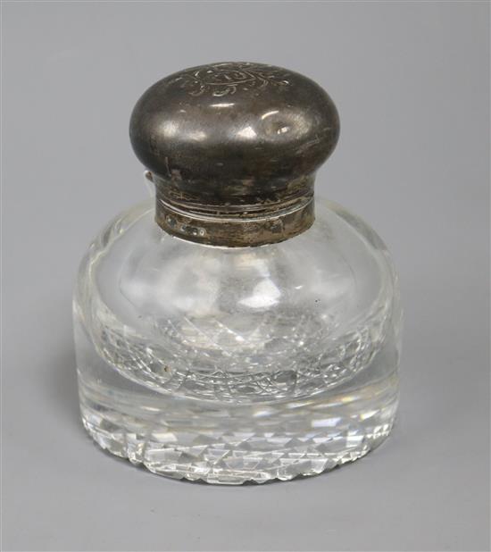 A Victorian silver mounted circular glass inkwell, 11.1cm.